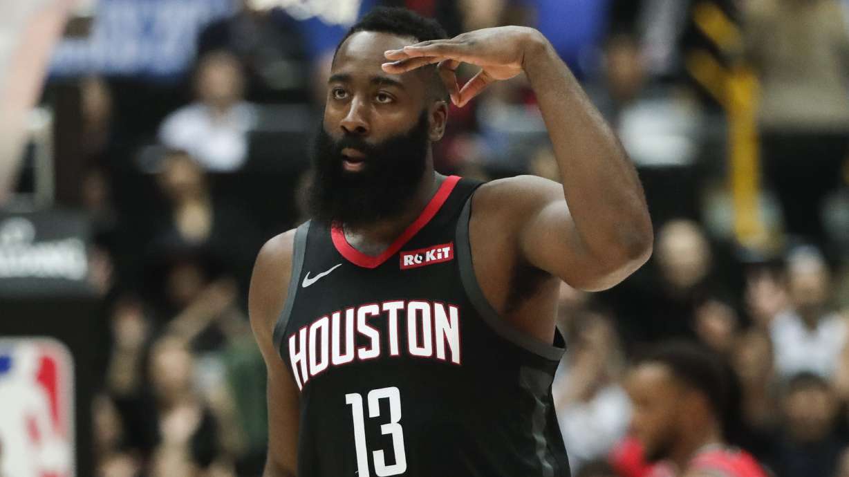 Harden dazzles, then Raptors rally past Rockets in Japan