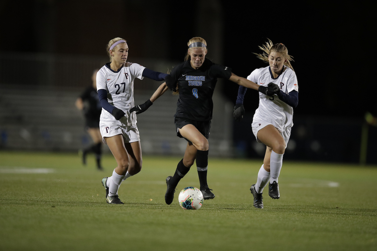 Mikayla Colohan fights off two Pepperdine defenders during BYU's 5-1 win over the Waves, Wednesday, Oct. 9, 2019 in Provo. (Courtesy: BYU Photo)