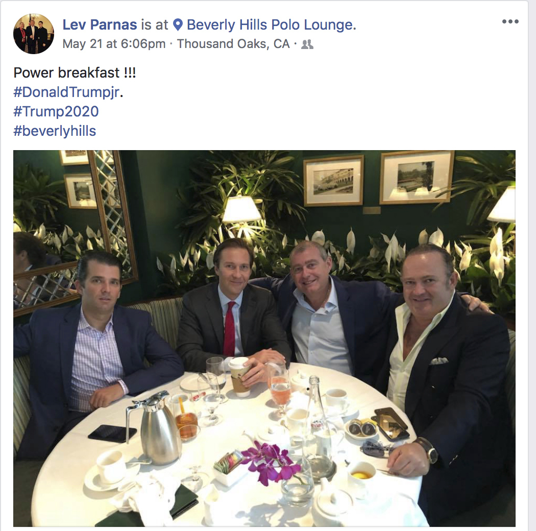 This Facebook screen shot provided by The Campaign Legal Center, shows from left, Donald Trump, Jr., Tommy Hicks, Jr., Lev Parnas and Igor Fruman, posted on May 21, 2018. (The Campaign Legal Center via AP)