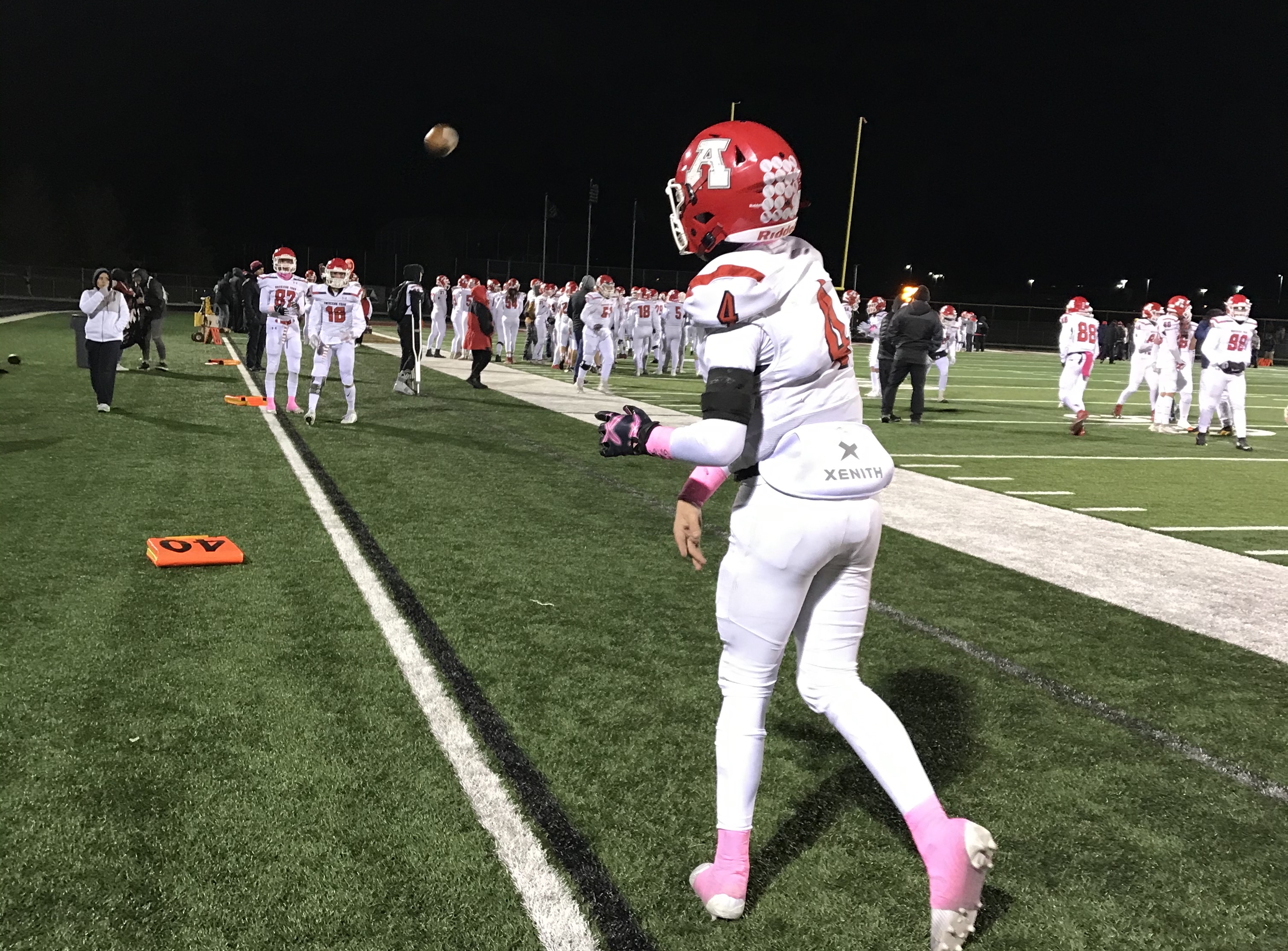 American Fork quarterback Maddux Madsen warms up on the sidelines during the Cavemen's 26-21 win over Lone Peak, Thursday, Oct. 10, 2019 in Highland, Utah.