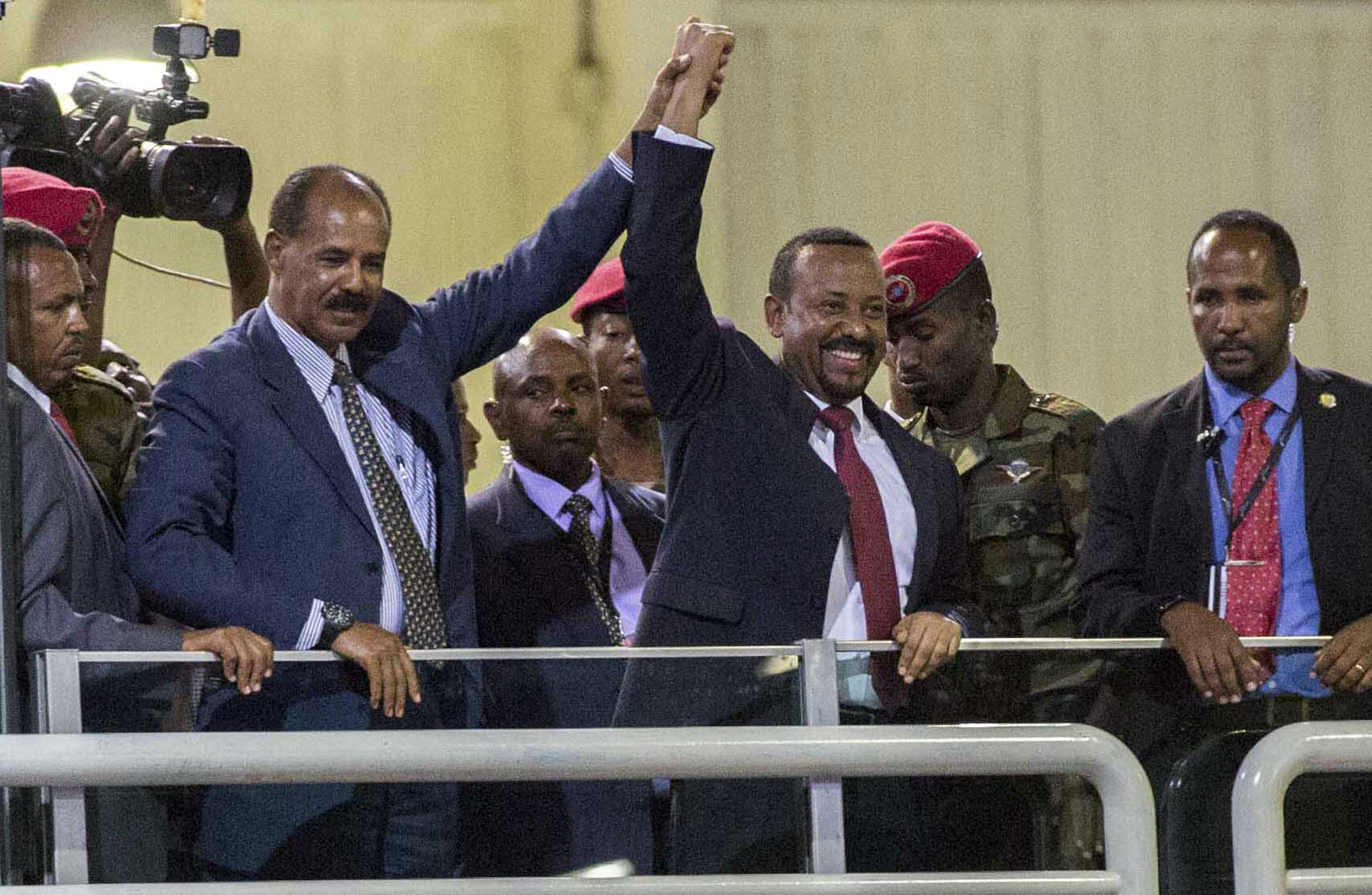 In this Sunday July 15, 2018 file photo, Eritrean President Isaias Afwerki, second left, and Ethiopia's Prime Minister Abiy Ahmed, center, hold hands as they wave at the crowds in Addis Ababa, Ethiopia. Photo: AP Photo