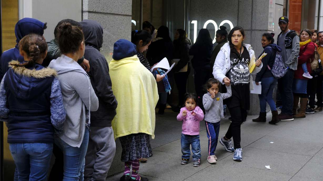 The Latest: Third judge blocks policy for green card denials