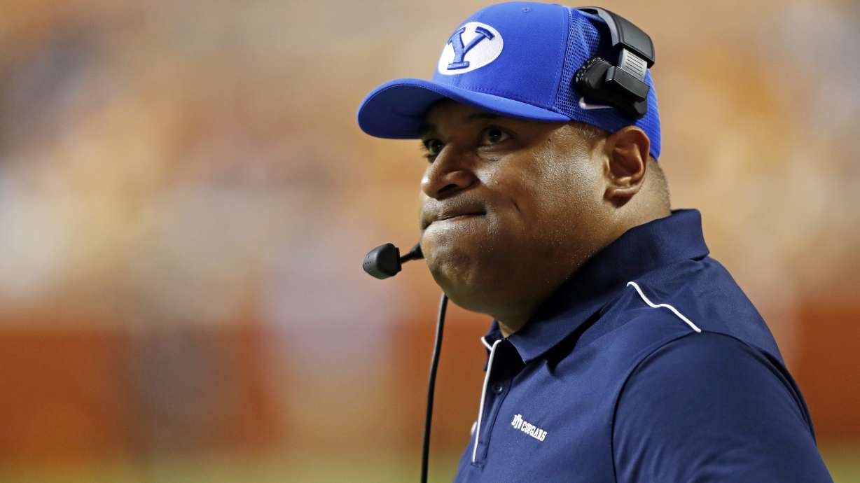 Brigham Young head coach Kalani Sitake looks at a replay on the Jumbotron in the first half of an NCAA college football game against Tennessee Saturday, Sept. 7, 2019, in Knoxville, Tenn.