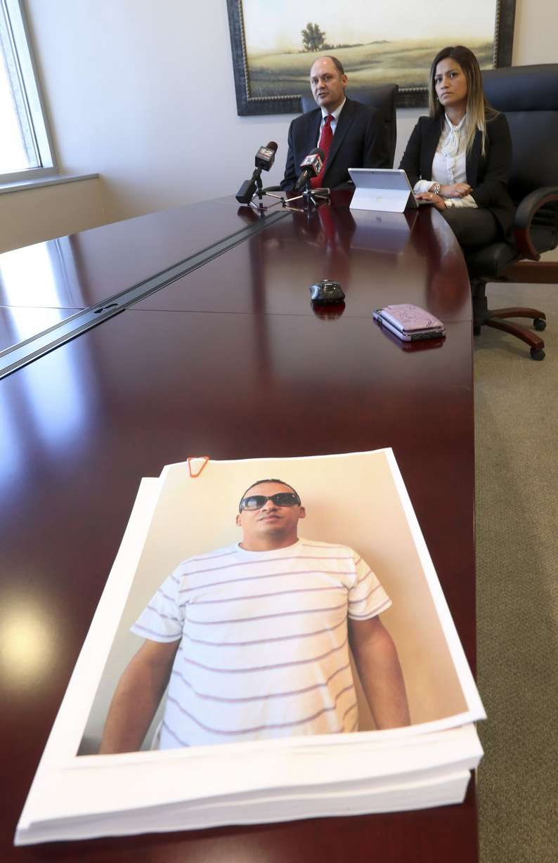 Attorney Dustin Lance, left, and immigration attorney Ysabel Lonazco talk about a case where their clients Robert Arias and his wife, Phawell Arias, are suing Dr. Paul Wade Wyatt, his wife, Marni Wyatt, Wyatt Eye and others, for traumatic injuries that they say Arias sustained to his right eye resulting in blindness, and the loss of his eye. Lance talked to the media from his offices in Salt Lake City on Monday, Oct. 14, 2019. (Photo: Steve Griffin, KSL)