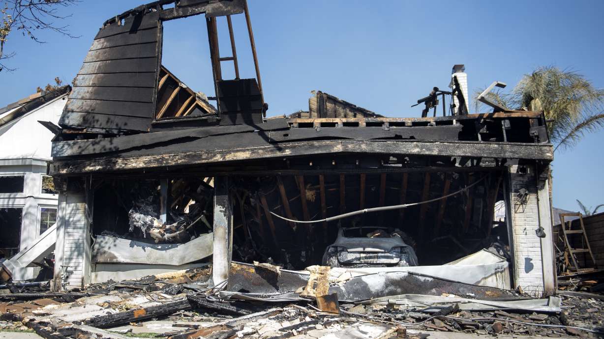 The Latest: Fire department: LA blaze began under power line