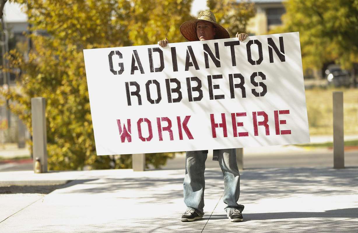 Jared Green holds a sign after a rally outside the federal courthouse in Salt Lake City on Tuesday, Oct. 15, 2019, to protest Rick Koerber's conviction. A jury last September found Koerber guilty of 15 counts of wire fraud, fraud in the offer and sale of securities, and money laundering. (Photo: Jeffrey D. Allred, KSL)