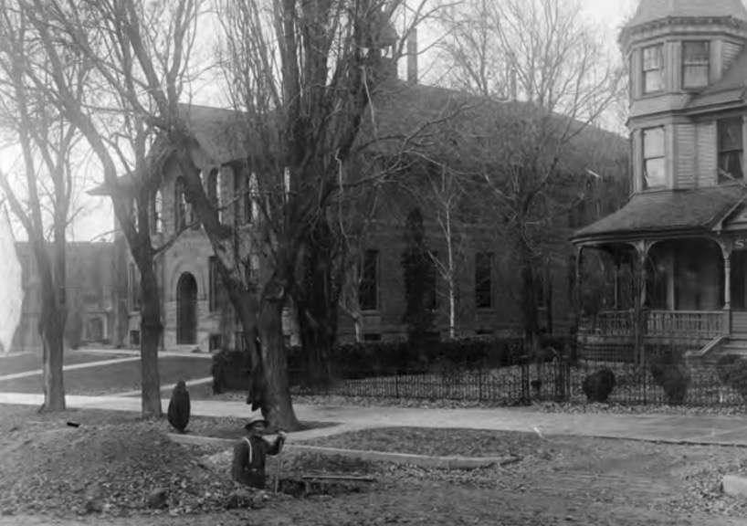 A construction worker digs a ditch in front of the old Central Junior High School building in 1913. The school originally opened as the New West Academy in 1887. It was torn down in 1959. (Photo: Utah State Archives)