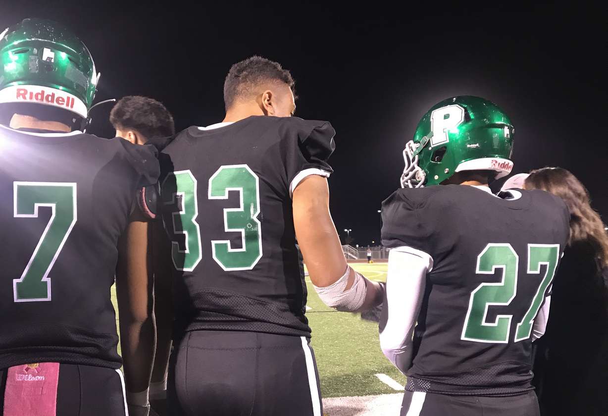 Provo running back Dallin Havea, left, with teammate Elias Barreto after Havea rushed for three first-half touchdowns to lead the Bulldogs to a 35-3 win over Payson and their first region title since 2005. (Photo: Sean Walker, KSL.com)