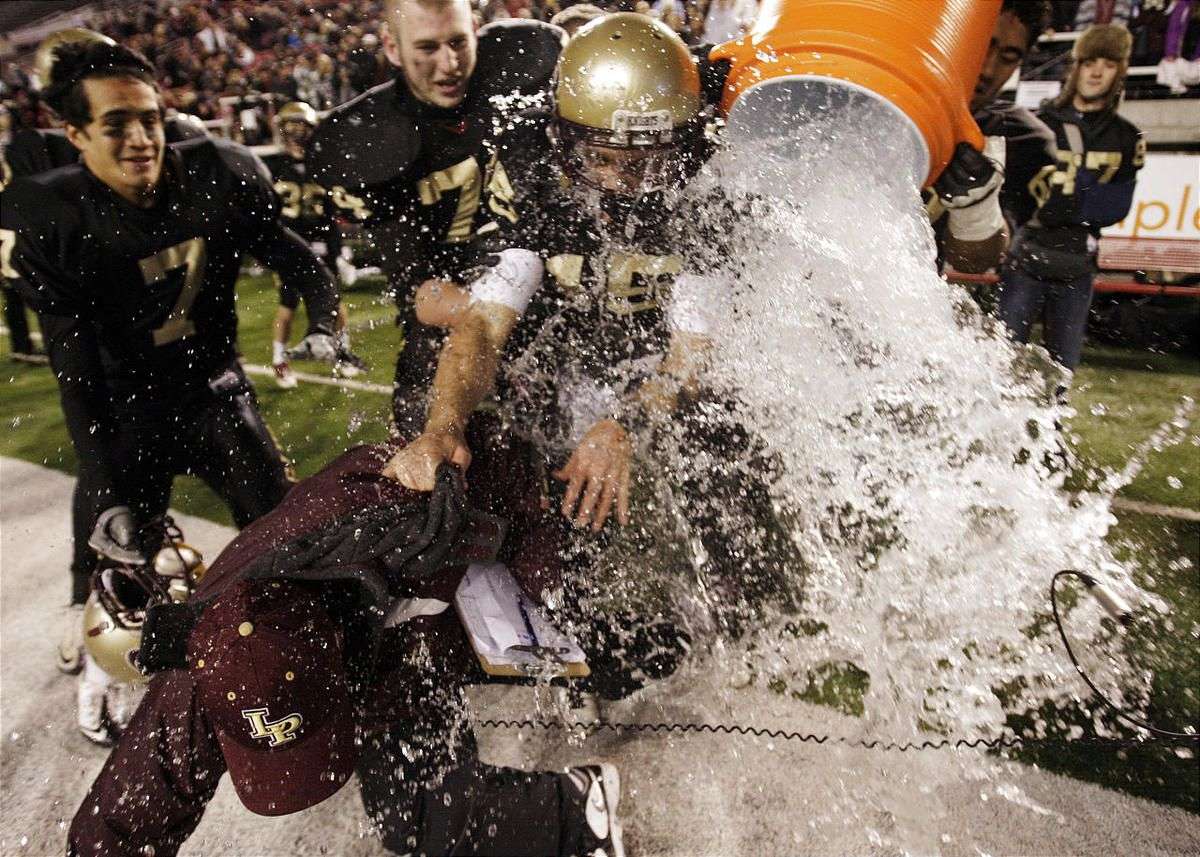 Lone Peak's Chase Hansen tries to hold down Coach Tony McGeary as the team dumps water on him as they beat Fremont in the 5A State Championship game in Salt Lake City Friday, Nov. 18, 2011. (Photo: Jeffrey D. Allred, Deseret News archives)