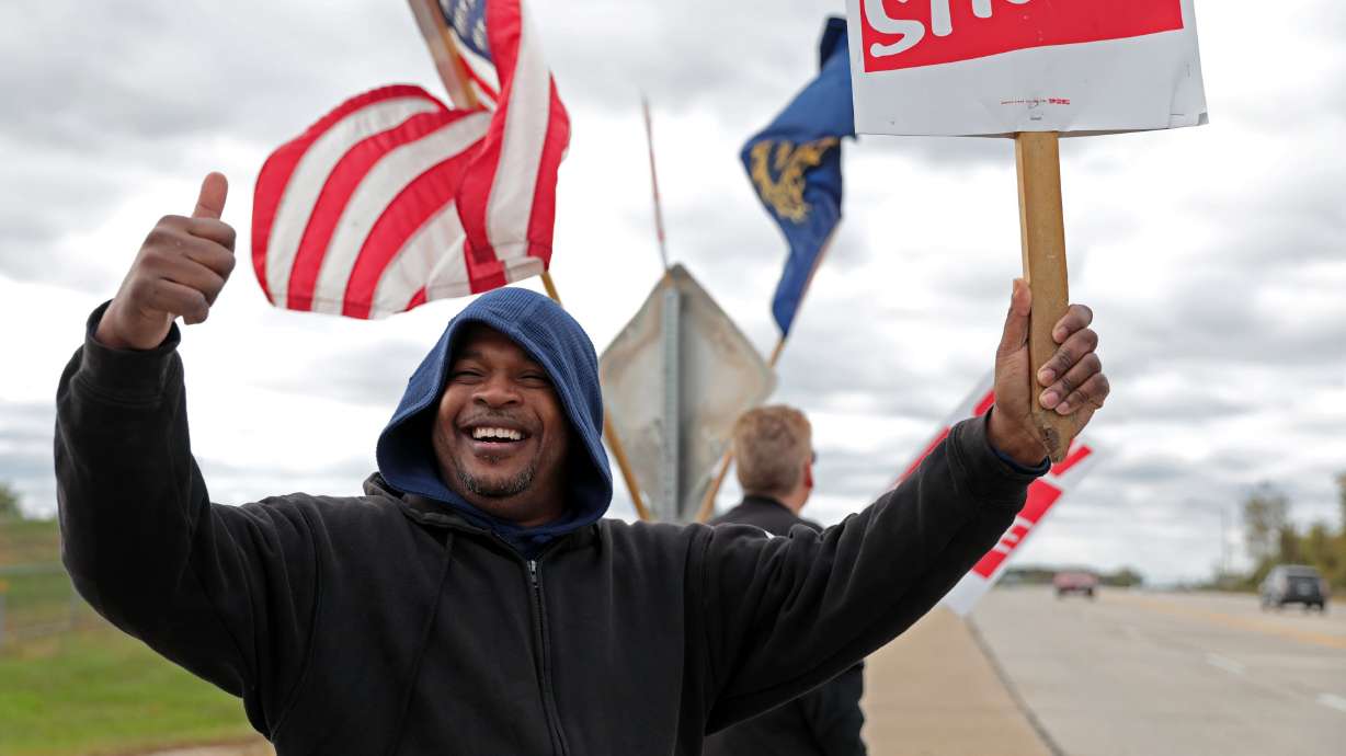 GM workers to stay on picket line until vote on new contract