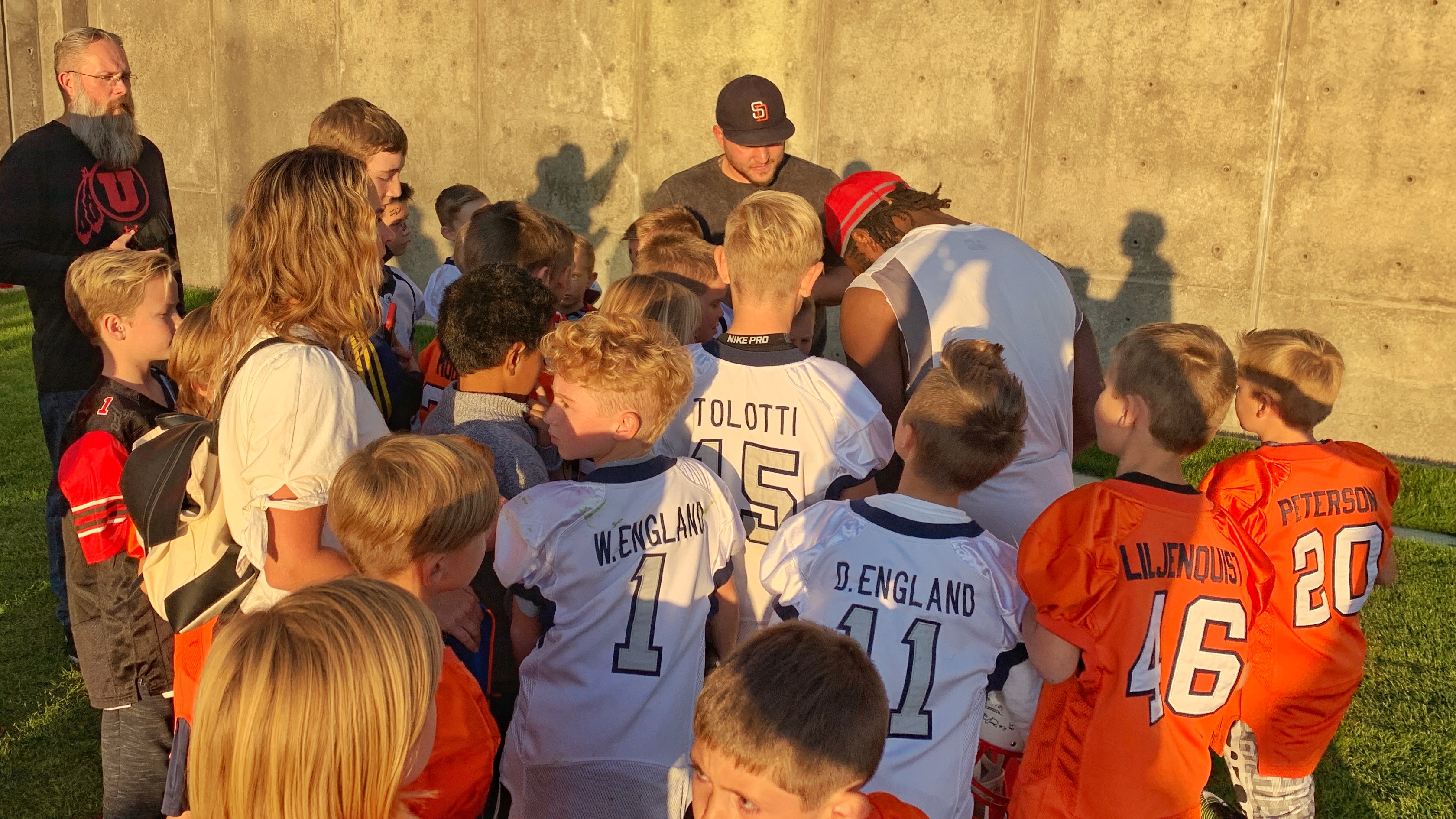 Utah running back Zack Moss signs autographs as he's is surrounded by kids from a local little league football team at the University of Utah practice facility on Oct. 15, 2019. (Photo: Josh Furlong, KSL.com)