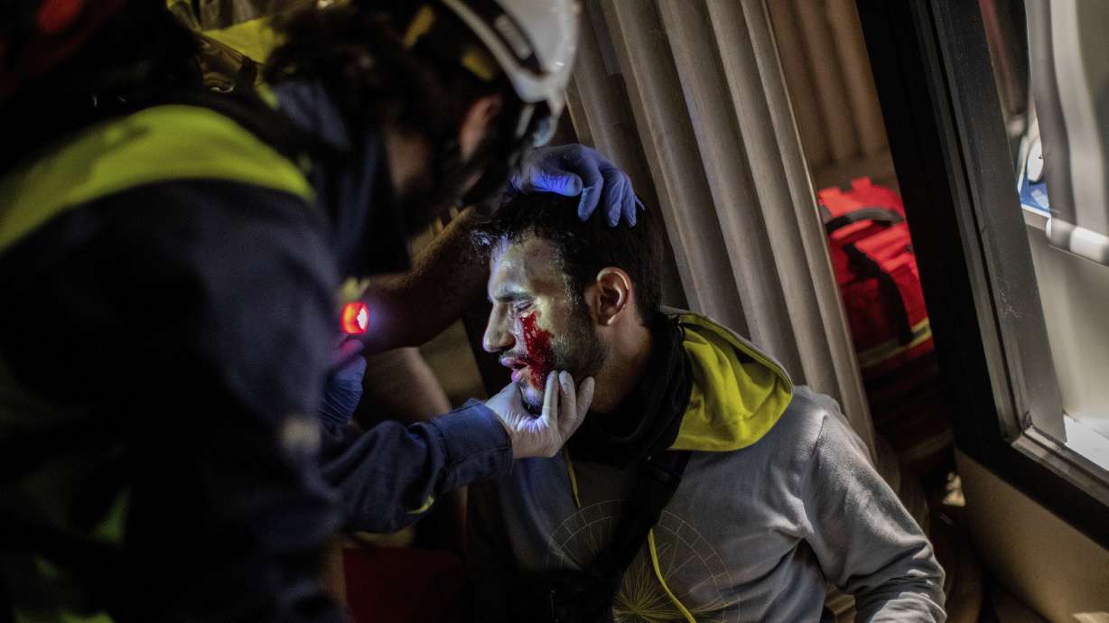 The Latest: Protesters battle police in chaos-hit Barcelona