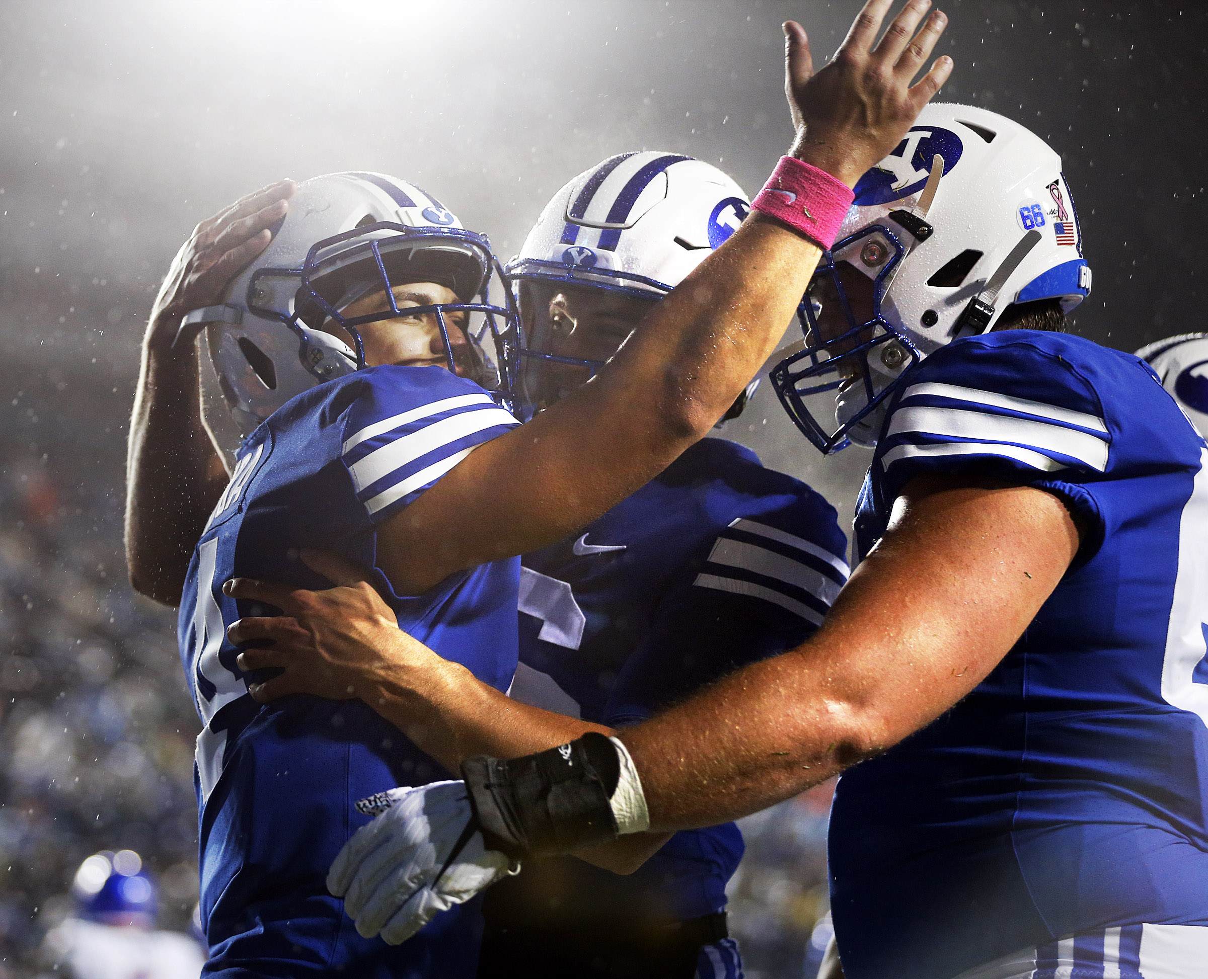 Brigham Young Cougars running back Lopini Katoa, left, celebrates with teammates after scoring a touchdown against the Boise State Broncos during an NCAA football game in Provo on Saturday, Oct. 19, 2019. (Photo: Ravell Call, KSL)