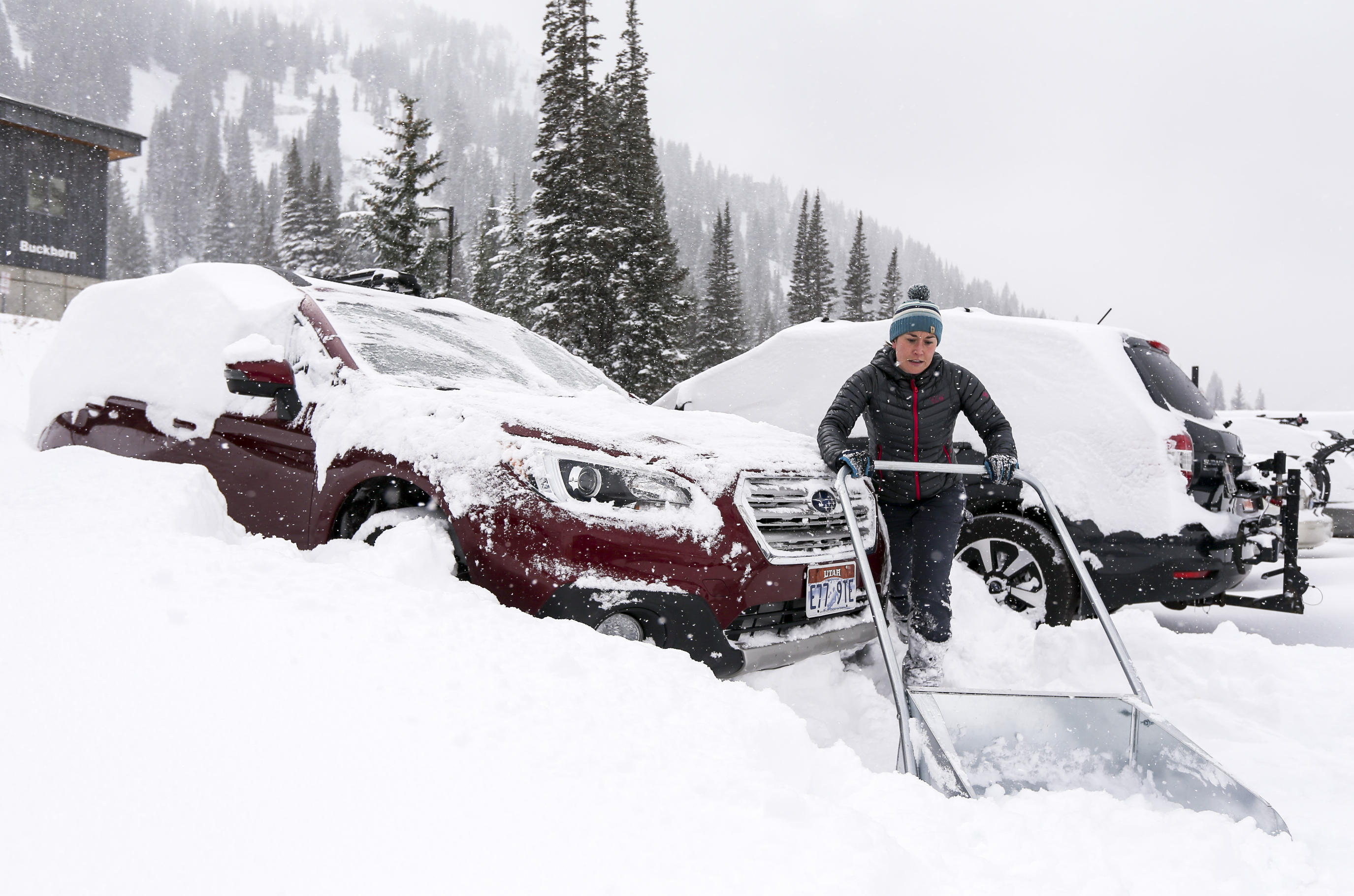 “I don’t want to do this tomorrow on my way to work,” says Claire Woodman as she shovels out her car in the Wildcat base area at Alta Ski Resort in Little Cottonwood Canyon to enjoy the first substantial snowfall of the year on Sunday, Oct. 20, 2019. Woodman’s husband woks up at the ski area and the couple live in one of the base area buildings. (Colter Peterson, KSL)
