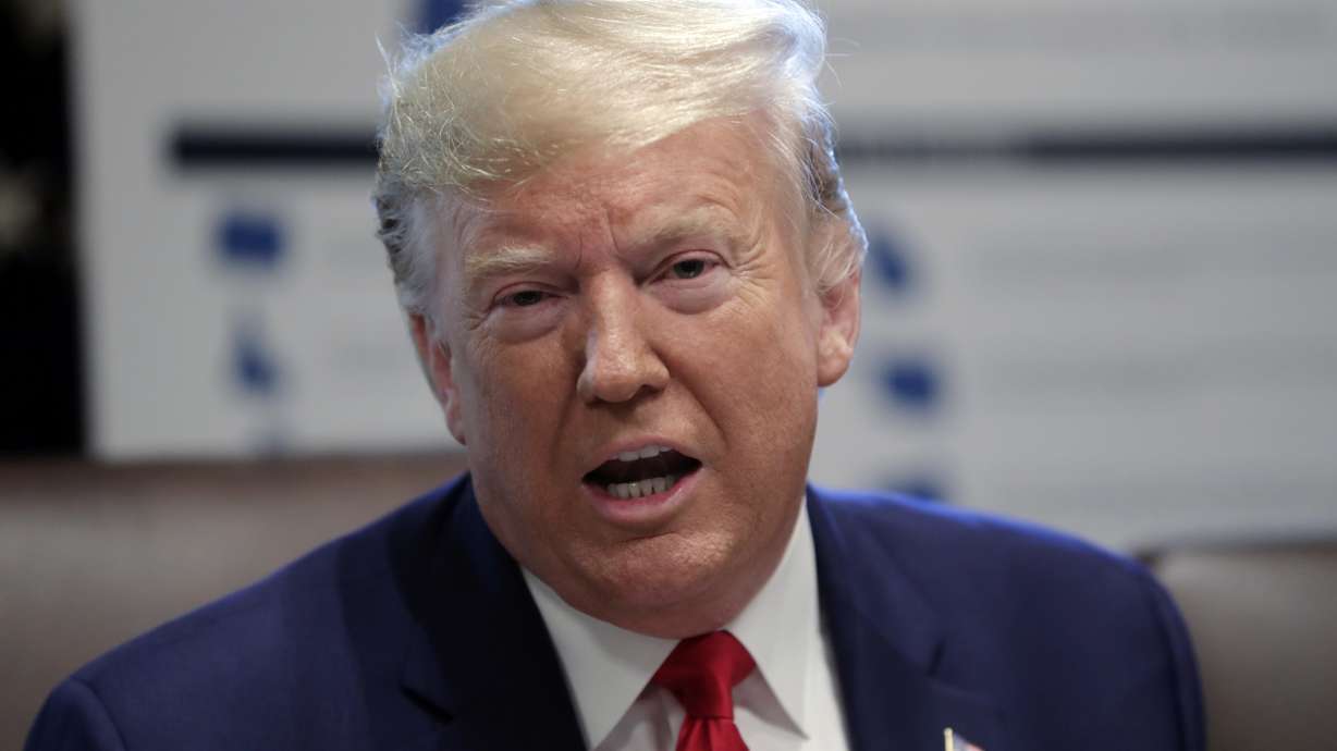 Trump defends Gabbard in Clinton spat, says she's no agent