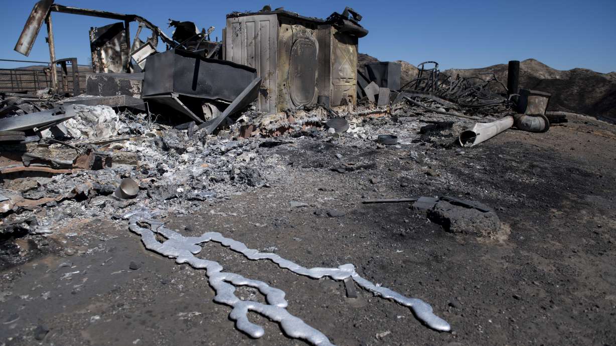 Firefighters race to control blazes before winds roar back