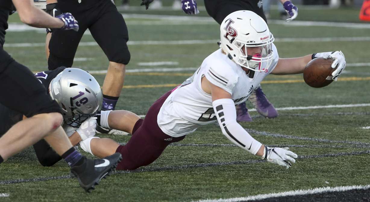 Lone Peak running back Chase Comer dives for the end zone as he scores a touchdown during the 6A football first round playoff game at Riverton on Friday, Oct. 25, 2019. (Photo: Steve Griffin, KSL)