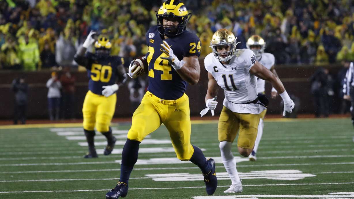 No. 19 Michigan routs No. 8 Notre Dame 45-14 in rain