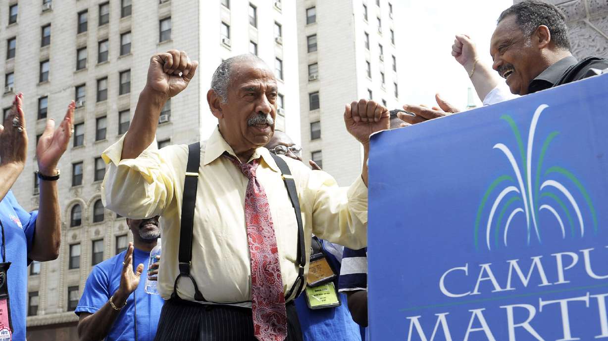 The Latest: Jackson says no King holiday without Conyers