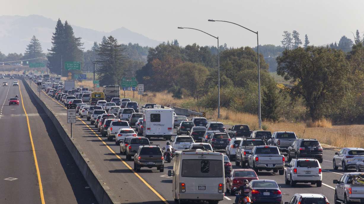 Residents flee, power cut as crews battle California fire