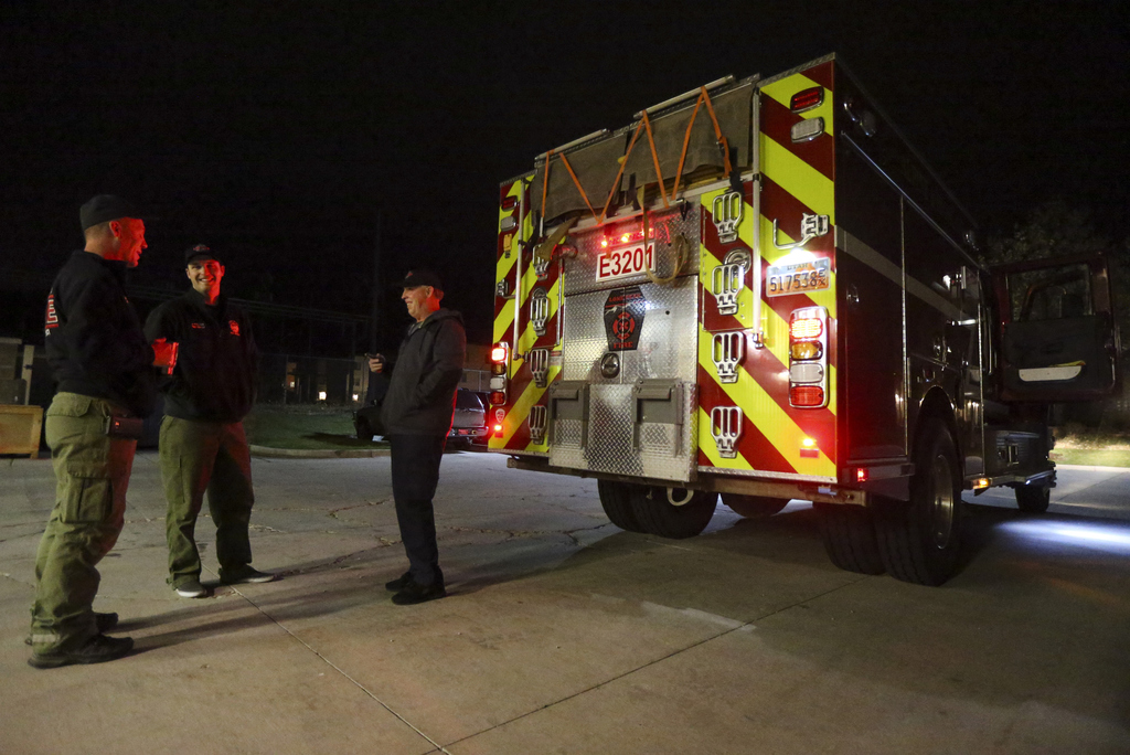 Chris Willden, left, John Pollock, center, and Lone Peak Fire Deputy Chief Chris Evans hold a small planning meeting before heading out from the Lone Peak Fire District Station in Highland for the Kincade Fire in California on Sunday, Oct. 27, 2019. (Photo: Colter Peterson, KSL)