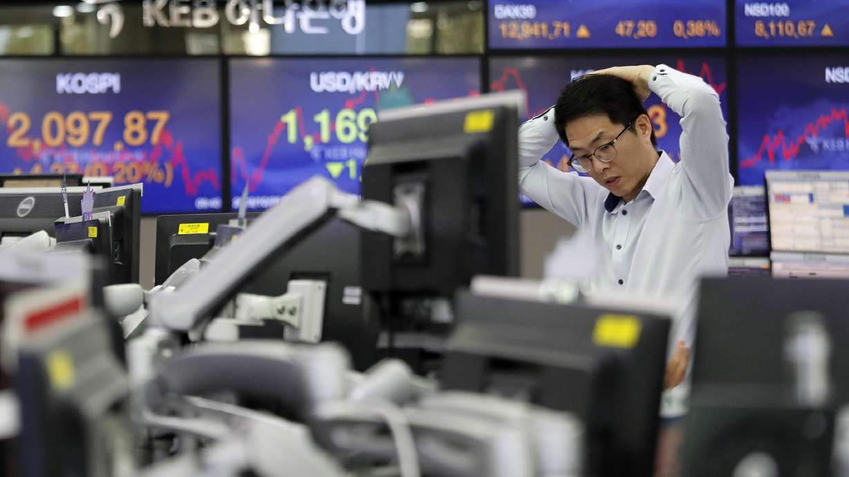 Global markets dip as week of earnings, reports heats up