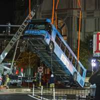 Cranes remove bus partially swallowed by Pittsburgh sinkhole