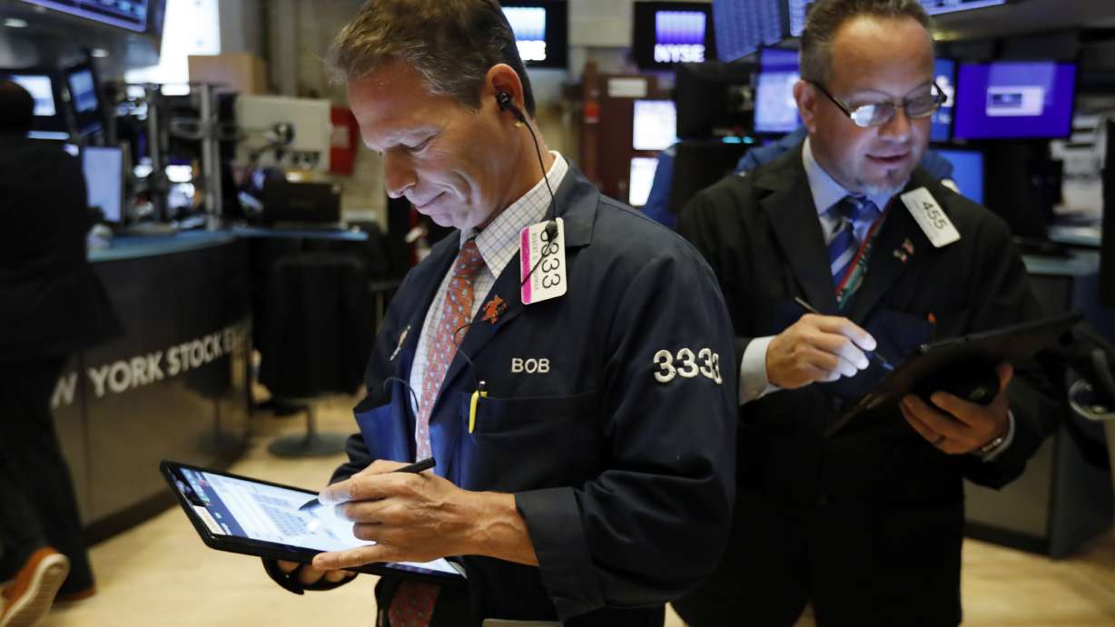 Asian shares mostly lower following Wall Street losses