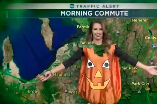 KSL traffic anchor Haley Smith wears a pumpkin costume while reporting traffic times as part of the nine different Halloween costumes she wore during Thursday Oct. 31, 2019's morning broadcast. (Photo courtesy of KSL TV)