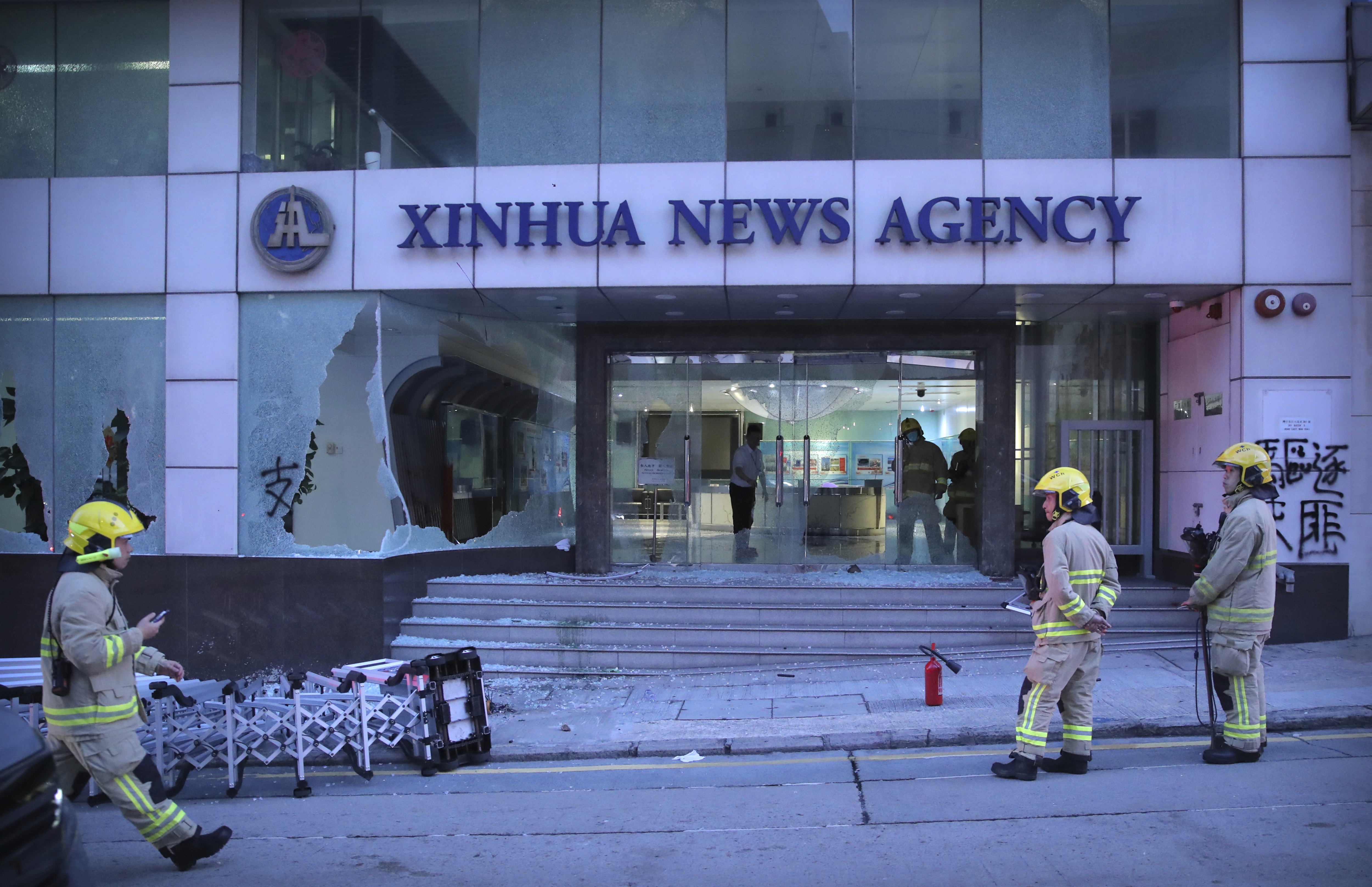 The Latest: Hong Kong protesters vandalize Xinhua office
