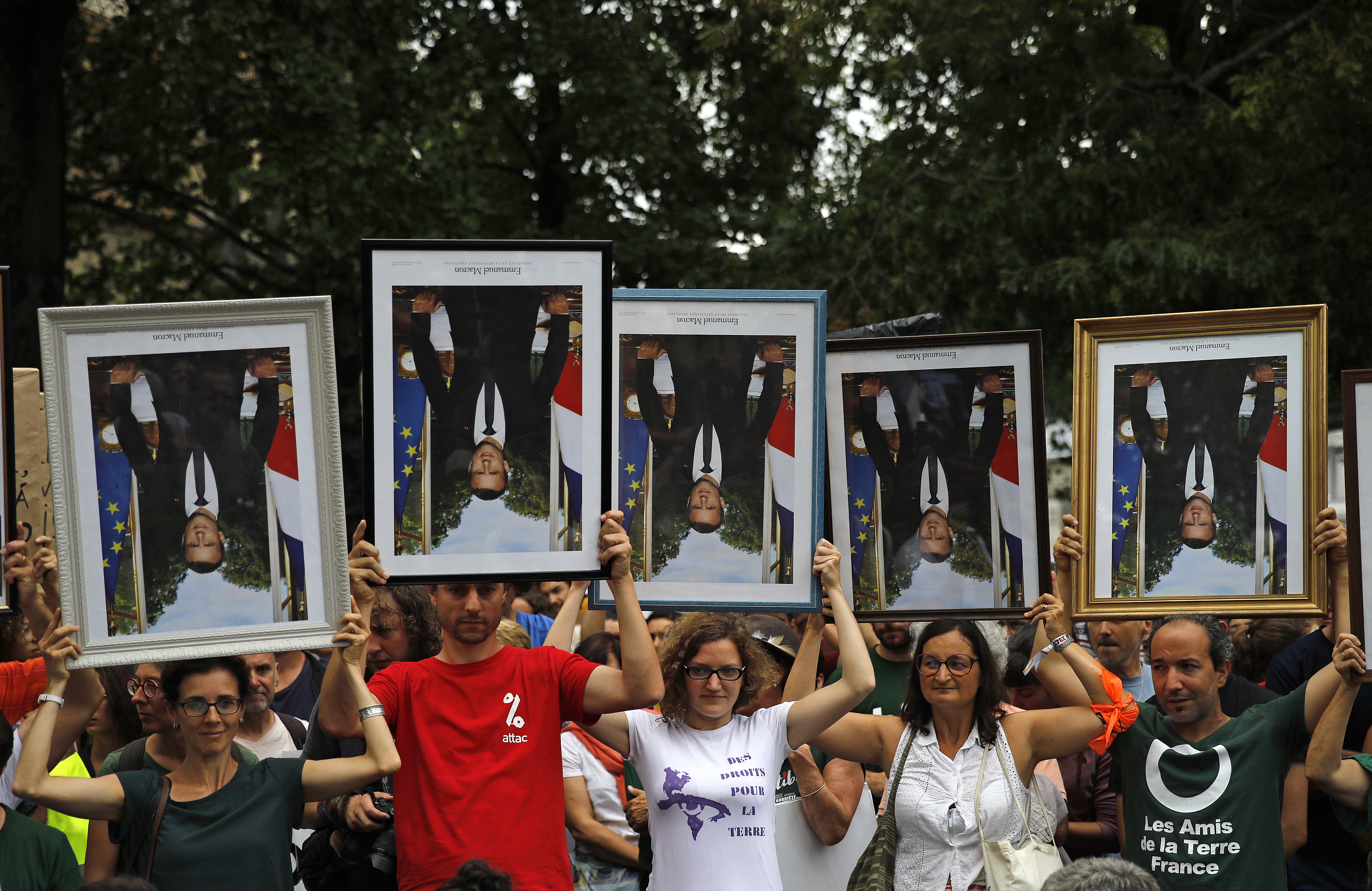 Climate activists nab Macron portraits, divide French judges