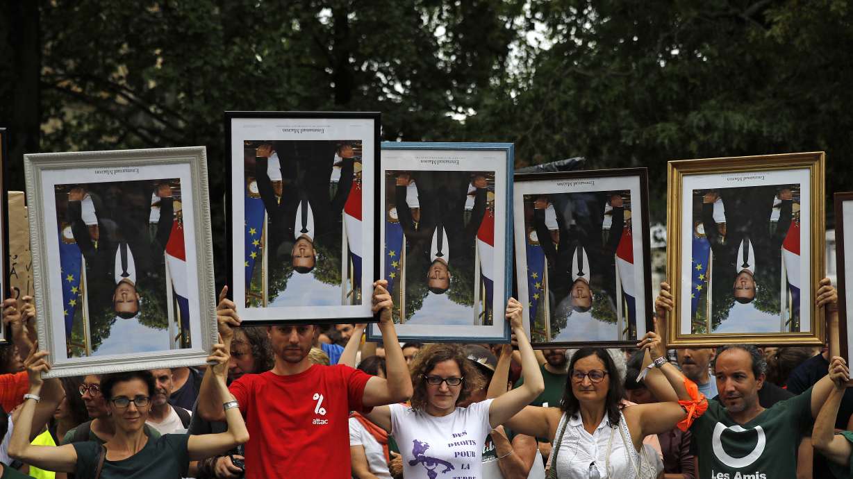 Climate activists nab Macron portraits, divide French judges