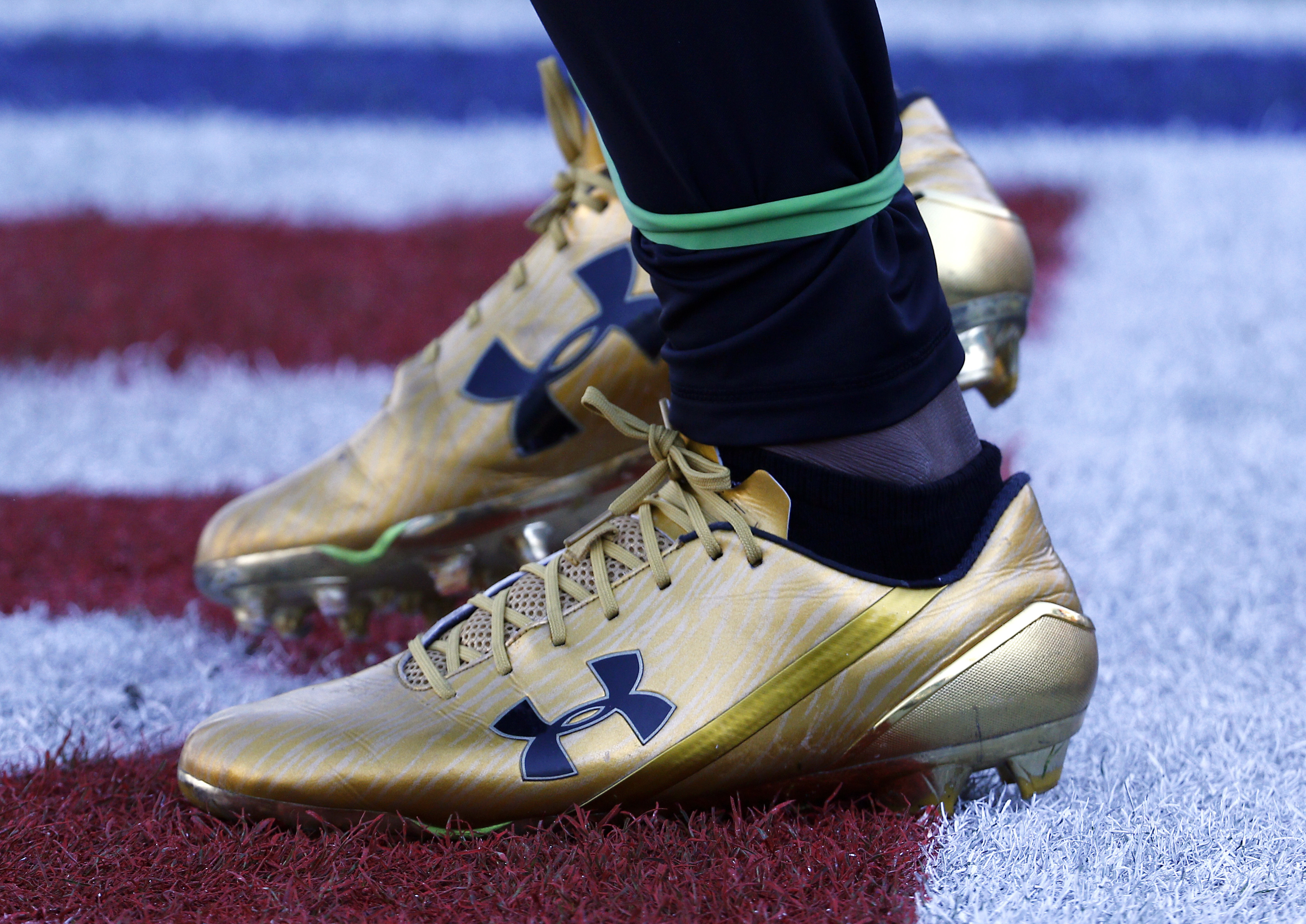 Jacksonville Jaguars running back T.J. Yeldon warms up wearing Under Armour cleats before an NFL football game against the Seattle Seahawks in Jacksonville, Florida, Dec. 10, 2017. The athletic clothing brand is struggling.