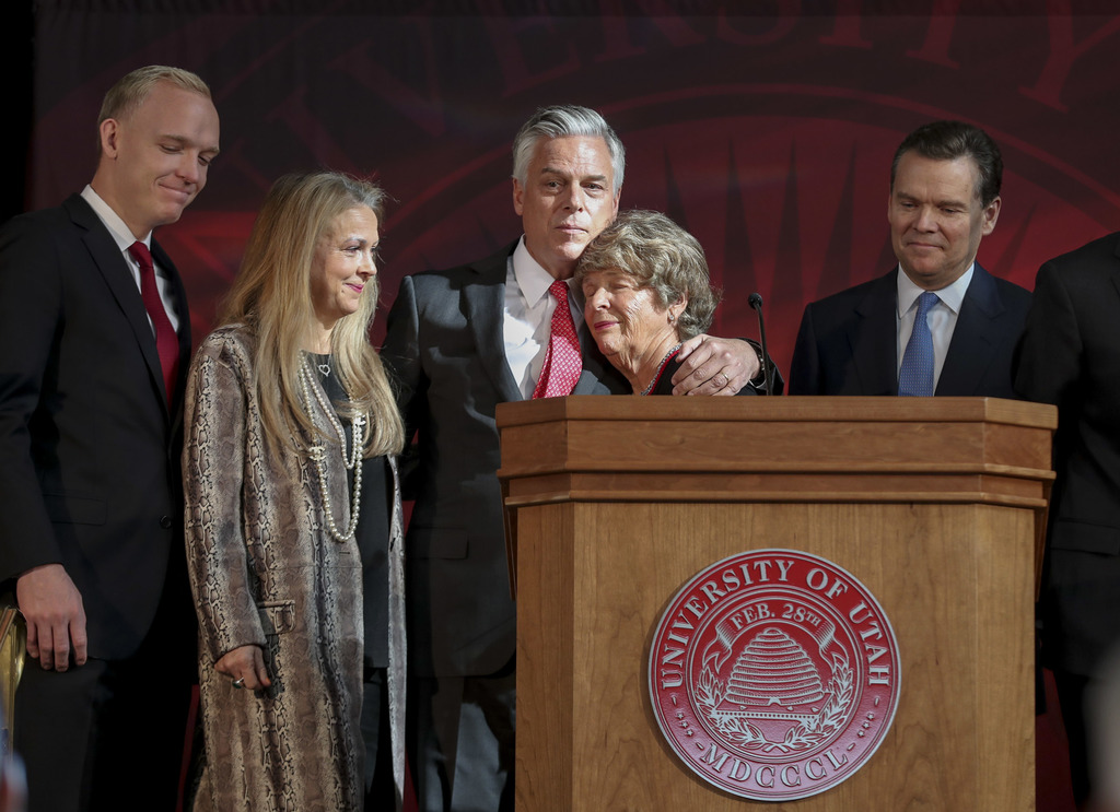 Karen Huntsman, fourth from left, hugs son Jon Jr., former governor of Utah, during a press conference at the University of Utah in Salt Lake City on Nov. 4, 2019, where the Huntsman family announced a $150 million commitment to establish the Huntsman Mental Health Institute at the U.