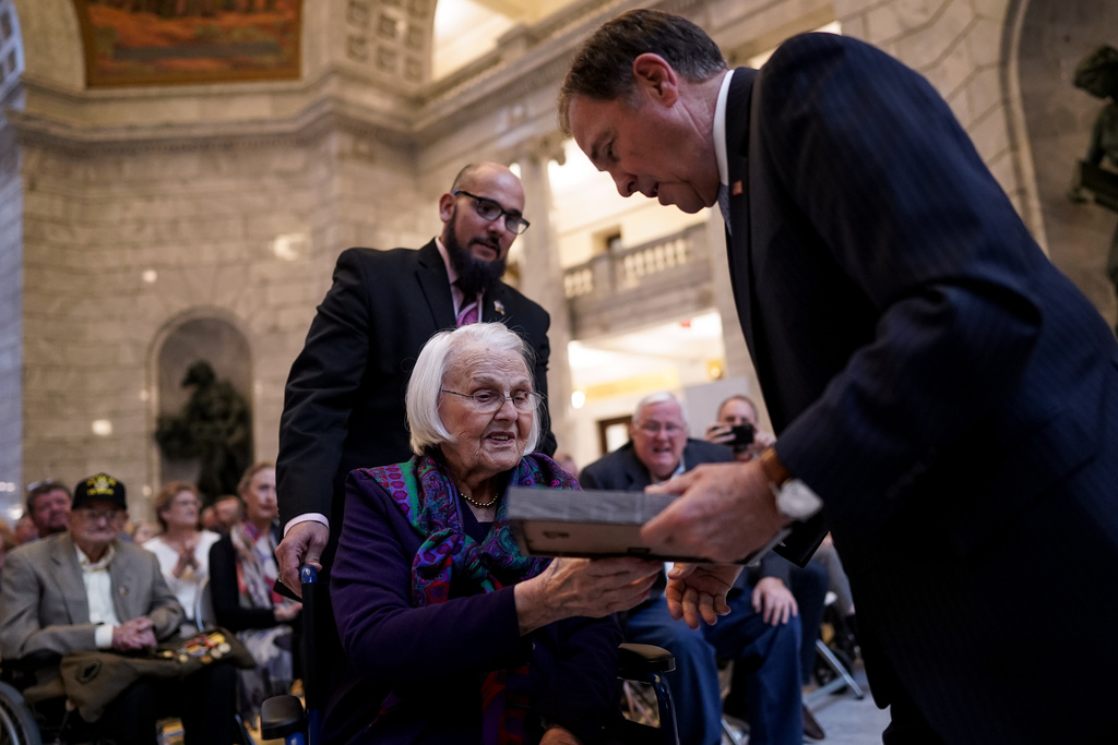 Lillie Fitzsimons, 101, who served as an Army nurse during World War II, receives a commemoration from Gov. Gary Herbert during a ceremony honoring centenarian veterans at the Capitol in Salt Lake City on Tuesday, Nov. 5, 2019. Photo: Spenser Heaps, KSL