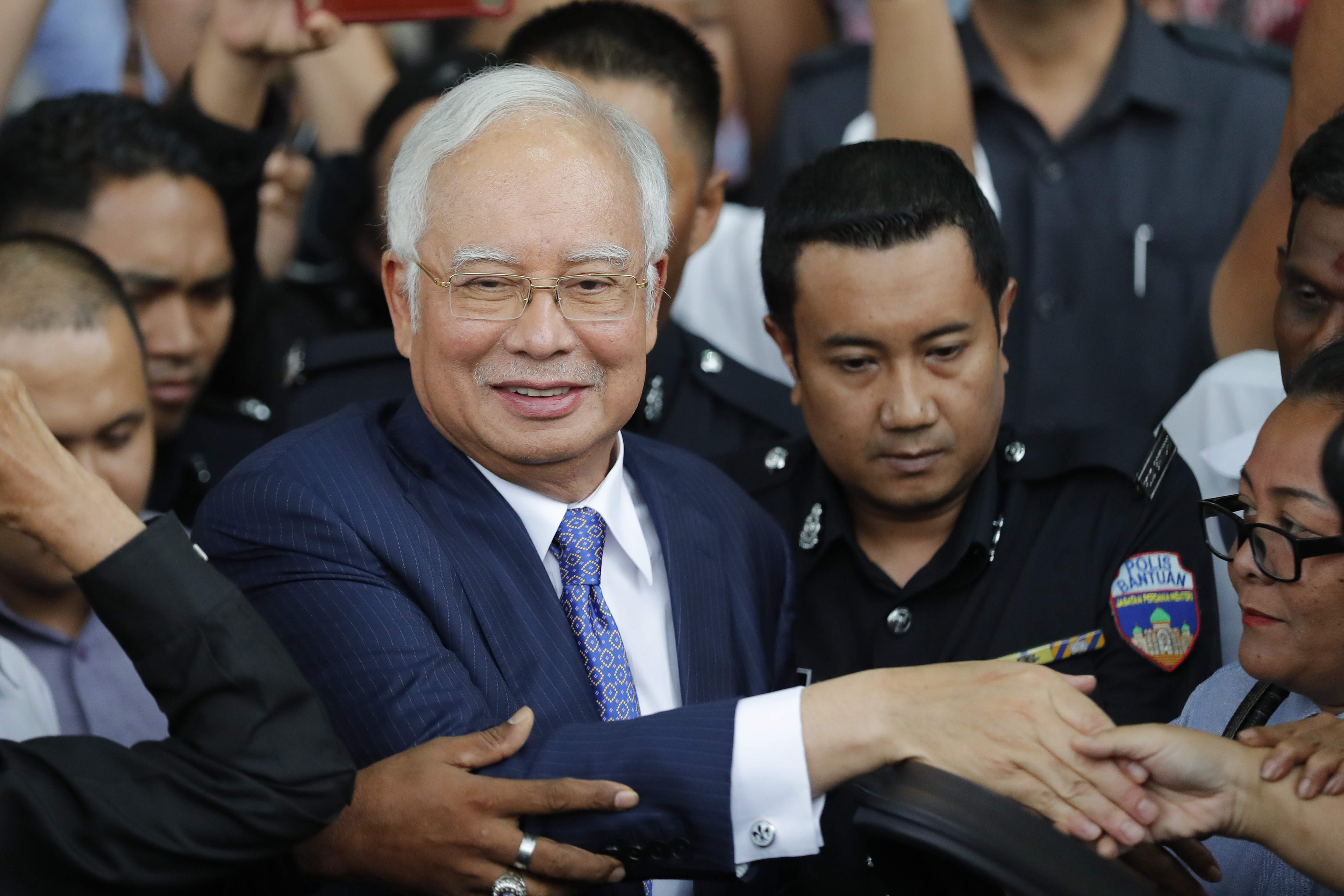 Graft ruling for Malaysian ex-leader a test for government
