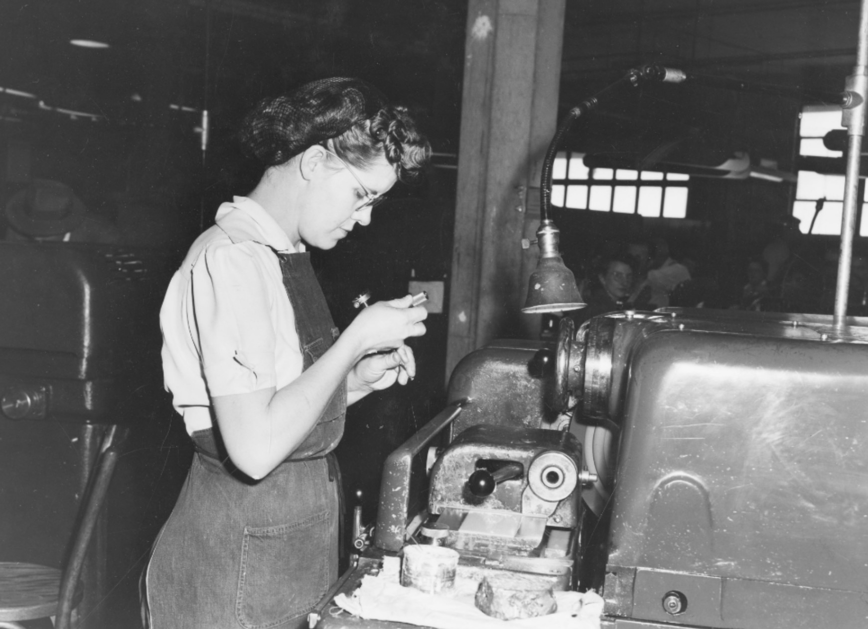 A woman working at a factory in December 1943 as World War II was happening and many men who worked factory jobs were enlisted in the military. (Photo: Utah State History)