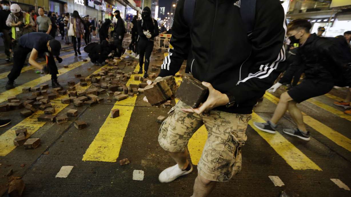Hong Kong police shoot protester, man set on fire