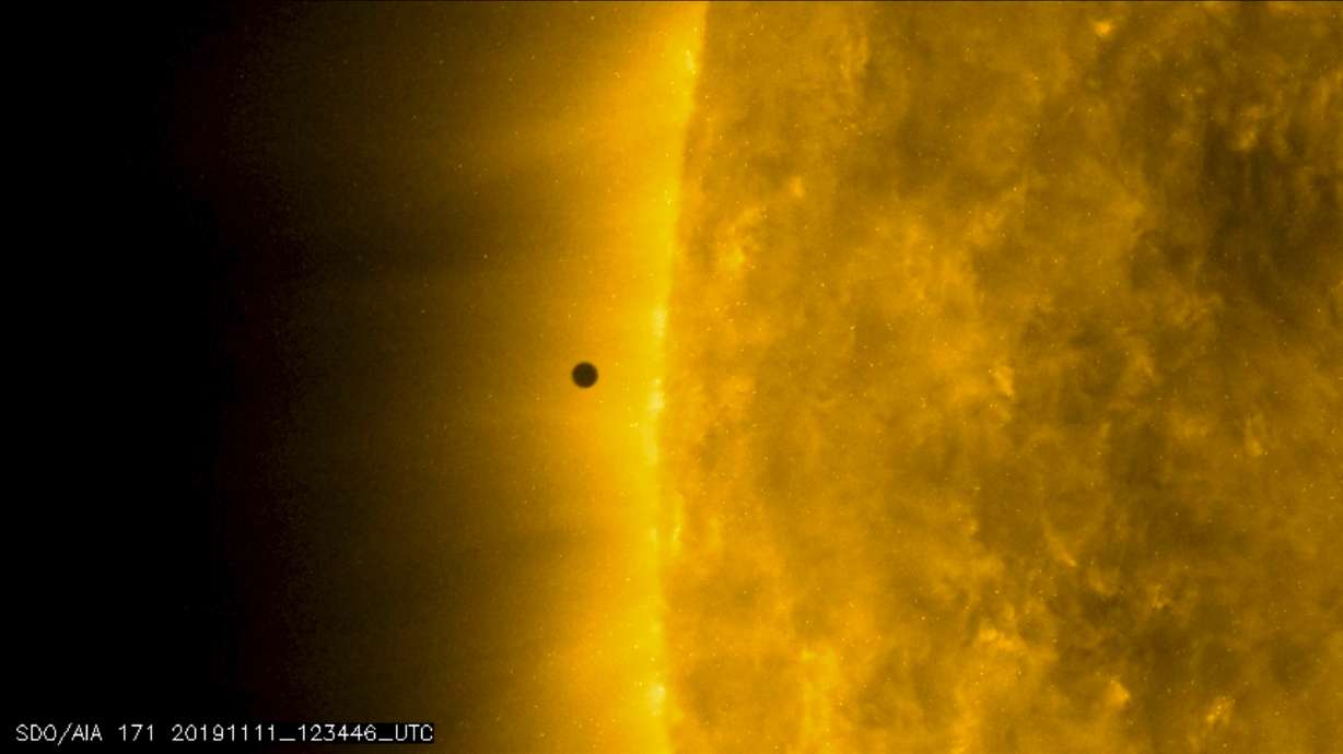 Mini Mercury skips across sun's vast glare in rare transit