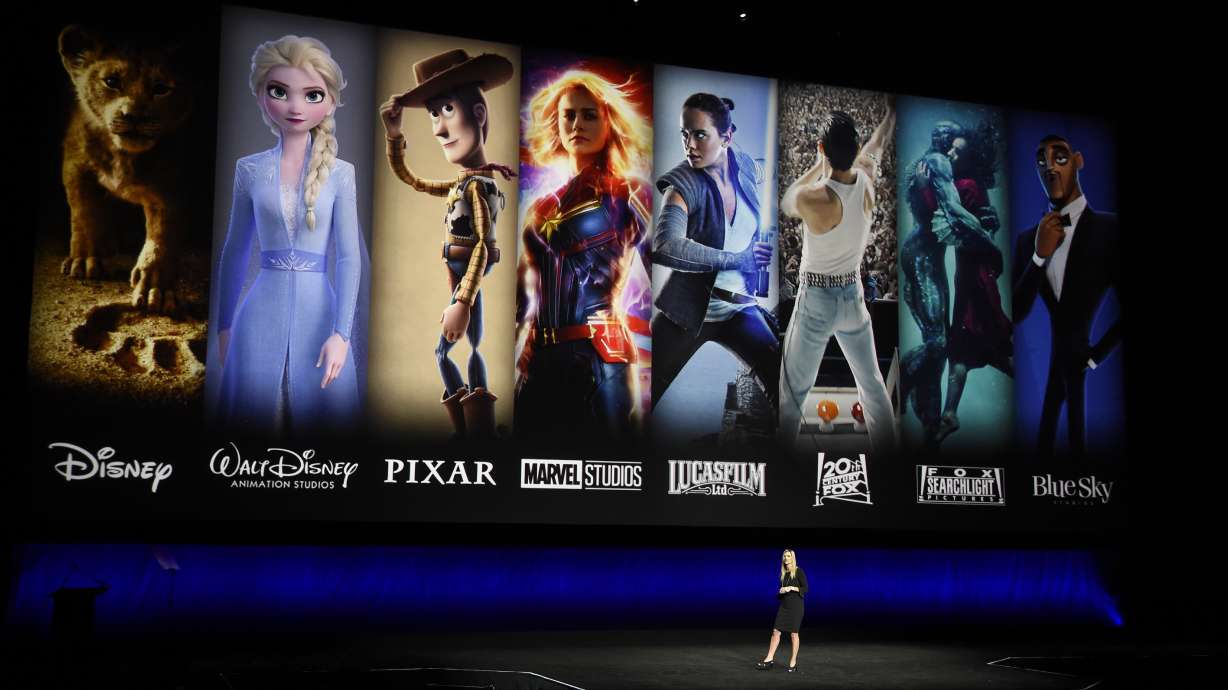Disney and Fox movies are displayed behind Cathleen Taff, president of distribution, franchise management, business and audience insight for Walt Disney Studios in this April 2019 photo.