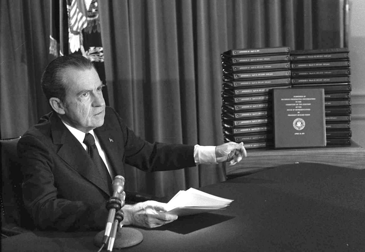 FILE - In this April 29, 1974 file photo, President Richard M. Nixon points to the transcripts of the White House tapes in Washington, after he announced on television that he would turn over the transcripts to House impeachment investigators. Photo: AP Photo, File