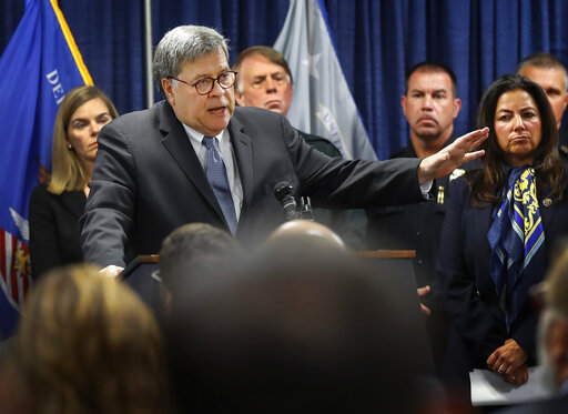 Attorney General William Barr, alongside officials from the Bureau of Alcohol, Tobacco, Firearms and Explosives, announces the launch of Project Guardian, an anti-gun violence initiative, during a news conference, Wednesday, Nov. 13, 2019, at the Davis-Horton Federal Building in Memphis Tenn. (Mark Weber/Daily Memphian via AP)