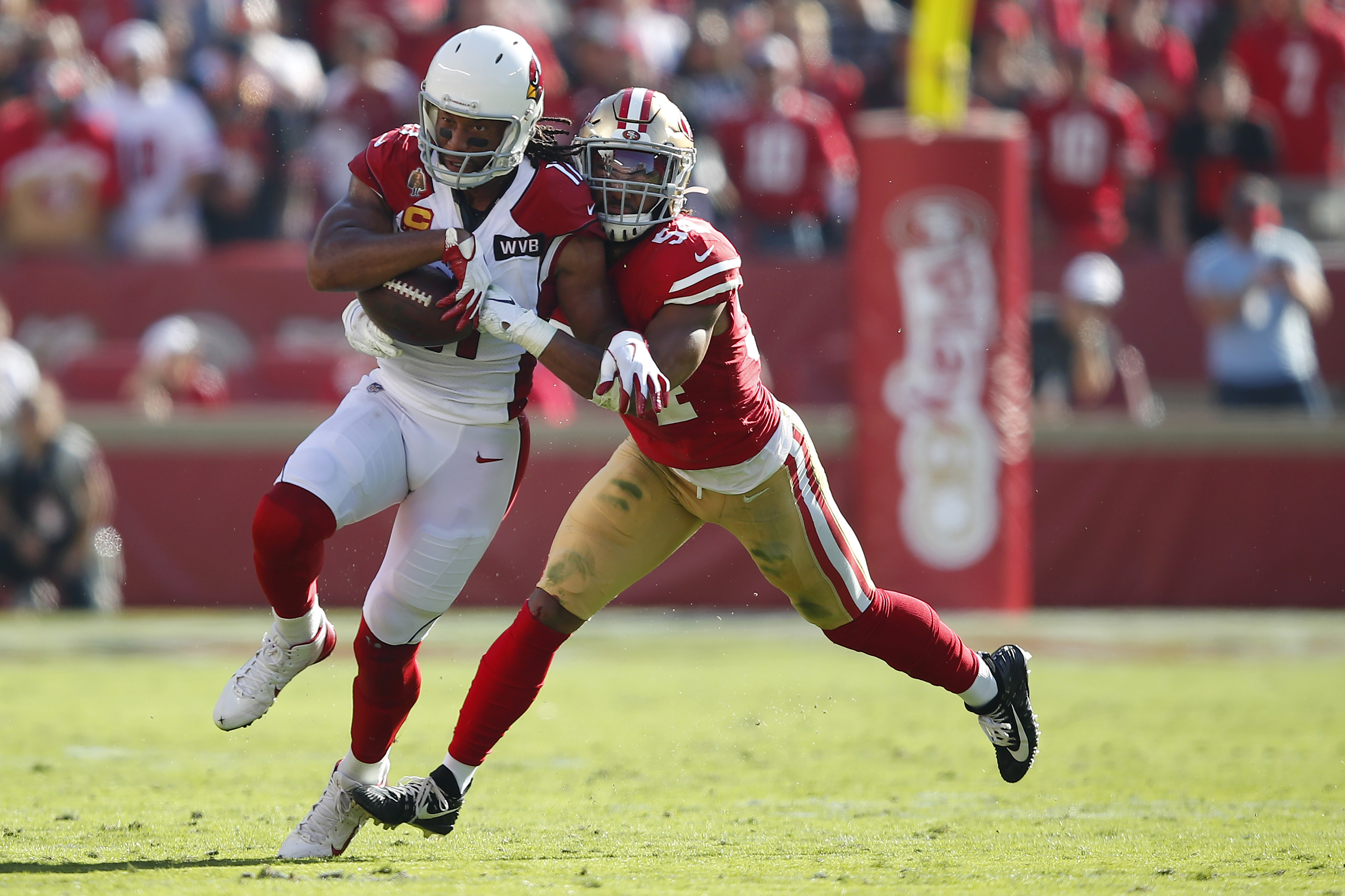 Arizona Cardinals wide receiver Larry Fitzgerald, left, runs against San Francisco 49ers middle linebacker Fred Warner during the first half of an NFL football game in Santa Clara, Calif., Sunday, Nov. 17, 2019. (Photo: John Hefti, AP)