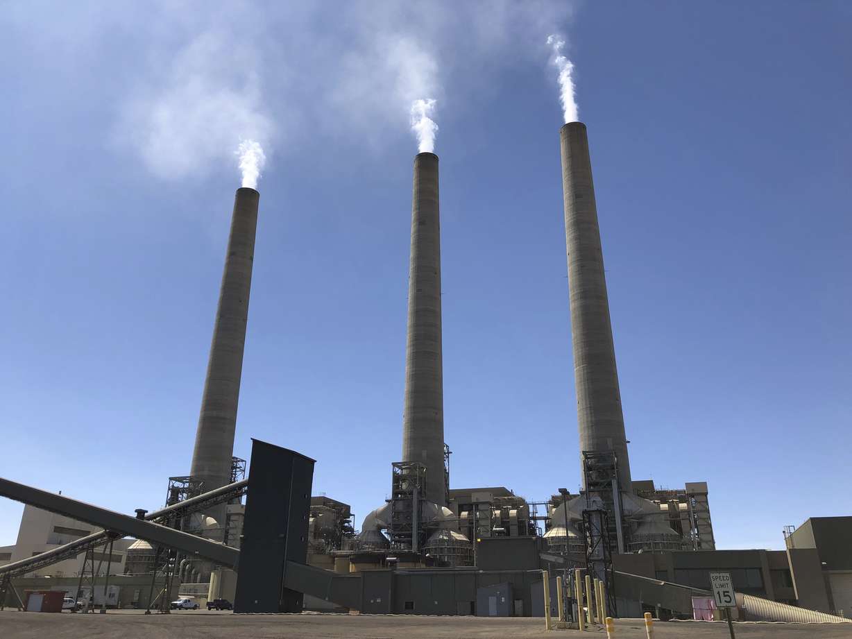 This Aug. 20, 2019, image shows a trio of concrete stacks at the Navajo Generating Station near Page, Ariz. Photo: Susan Montoya Bryan, AP Photo