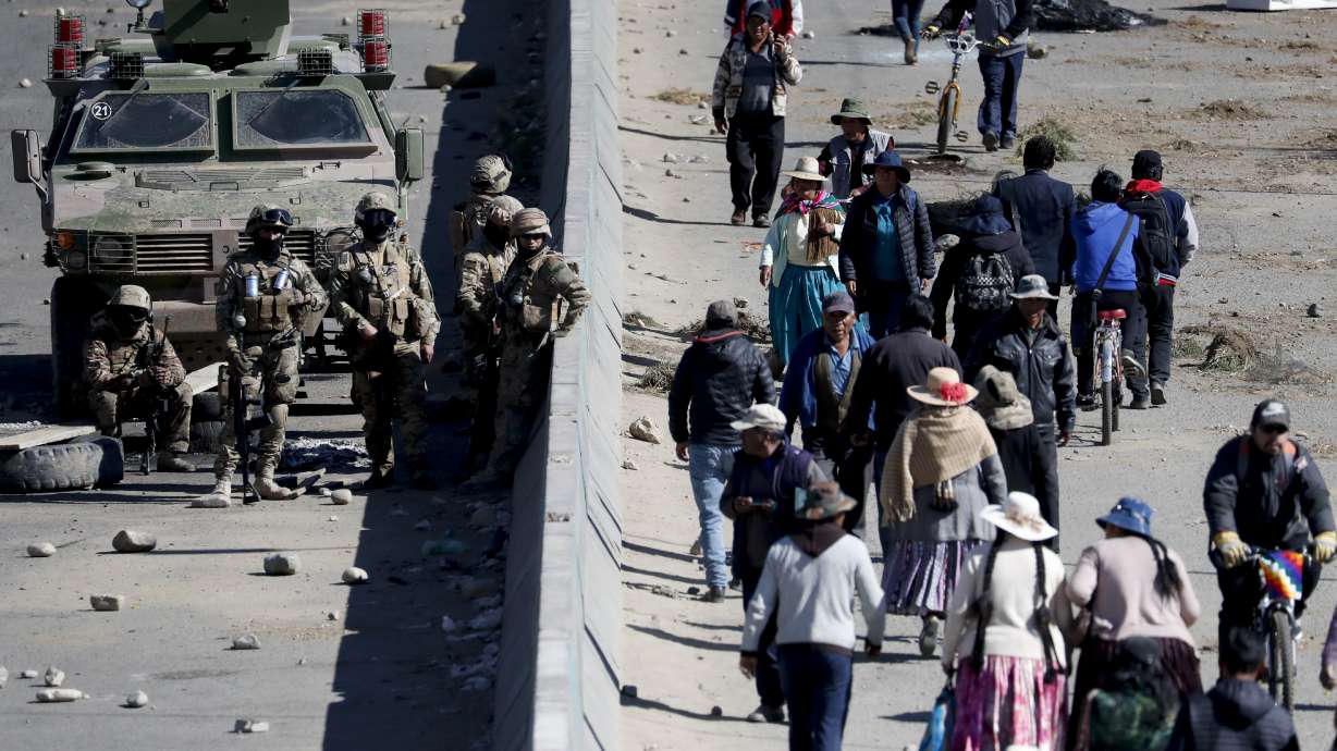 Bolivian interim leader proposes new elections as toll rises