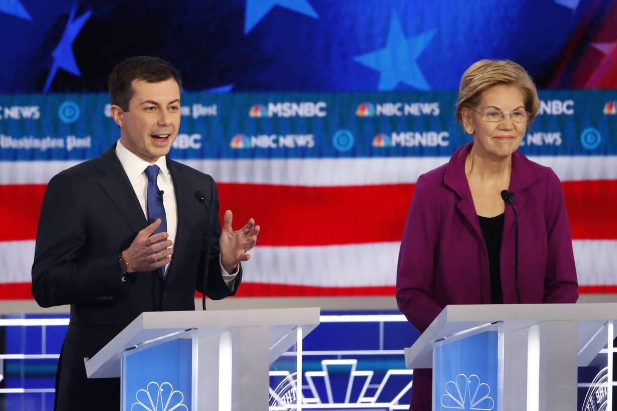 Democratic presidential candidate South Bend, Ind., Mayor Pete Buttigieg speaks as Democratic presidential candidate Sen. Elizabeth Warren, D-Mass., listens during a Democratic presidential primary debate, Wednesday, Nov. 20, 2019, in Atlanta. (AP Photo)