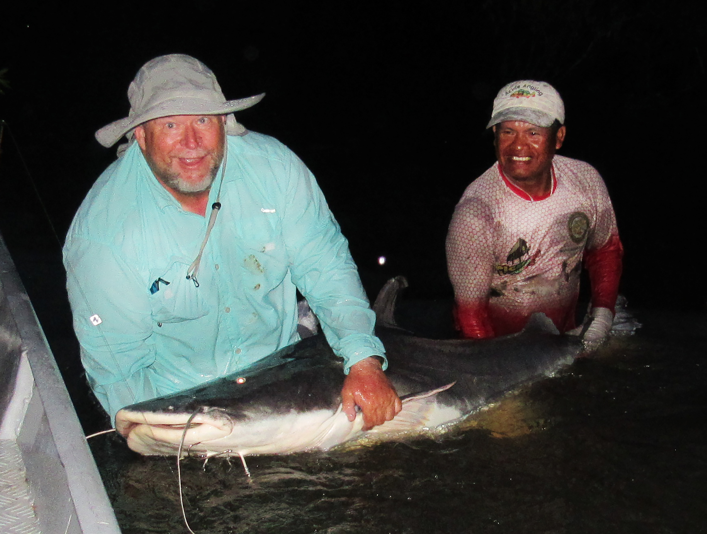 Hauling in one of the Ƅiggest catfish caught during the Aмazon trip. (Photo: Flint Stephens)