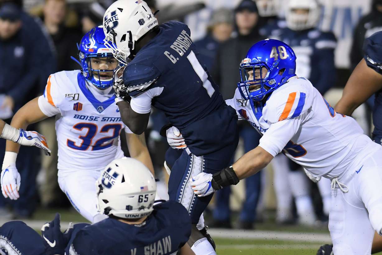 Boise State linebacker Bruno DeRose (48) tackles Utah State running back Gerold Bright (1) during the first half of an NCAA college football game Saturday, Nov. 23, 2019, in Logan, Utah. (Photo: Eli Lucero, AP)