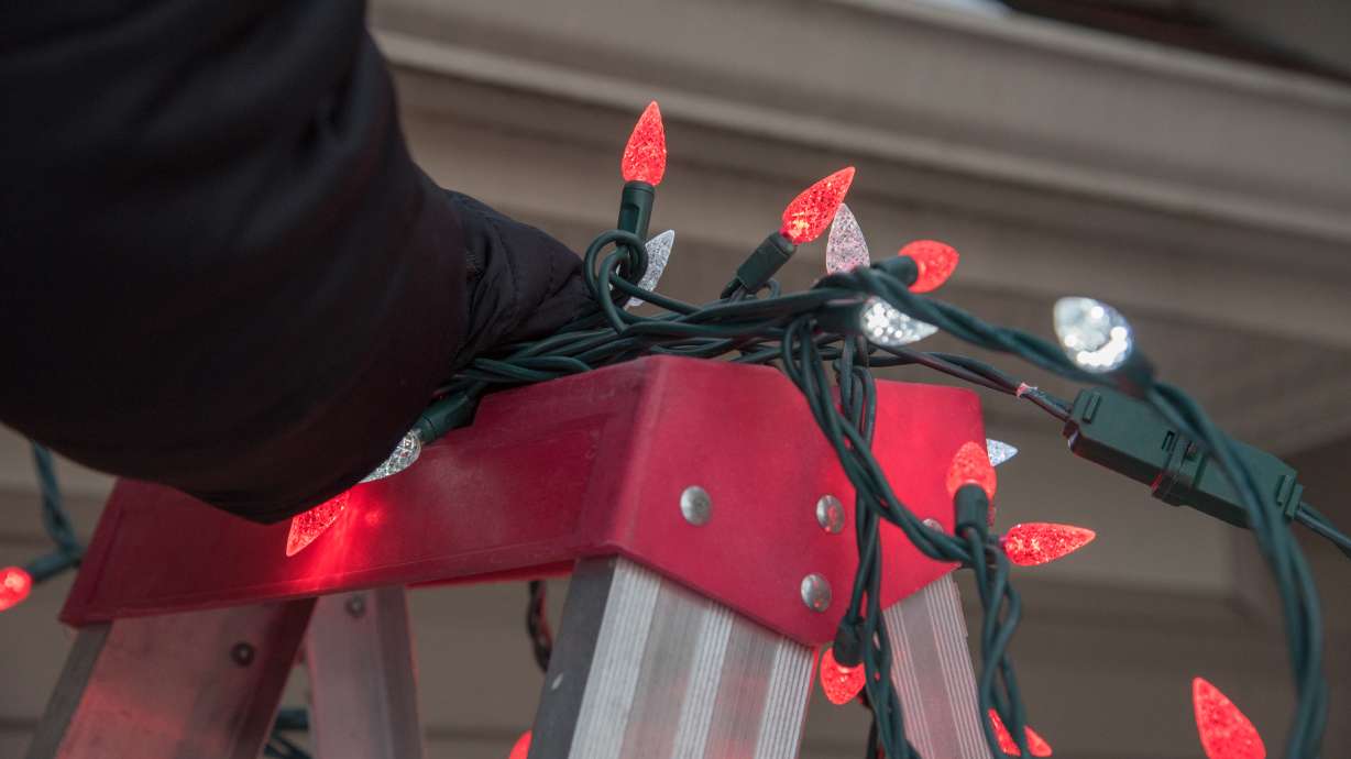Woman taken by medical chopper after falling around 20 feet while hanging Christmas lights