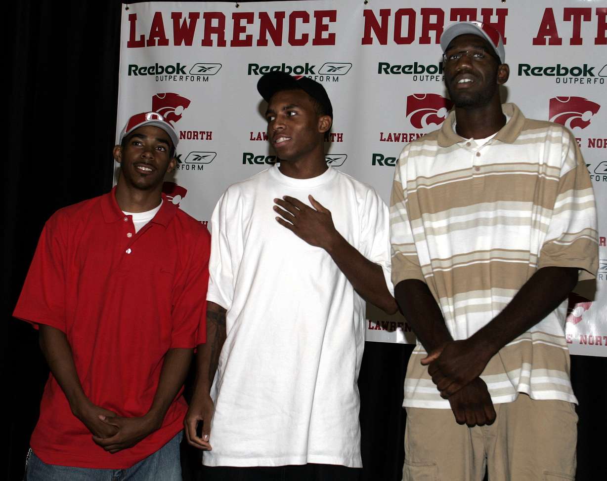 Lawrence North's Greg Oden, right, and Mike Conley, left, are joined by Daequan Cook of Dayton (Ohio) Dunbar High School after they announced that the two will attend Ohio State. (AP Photo/Michael Conroy)
